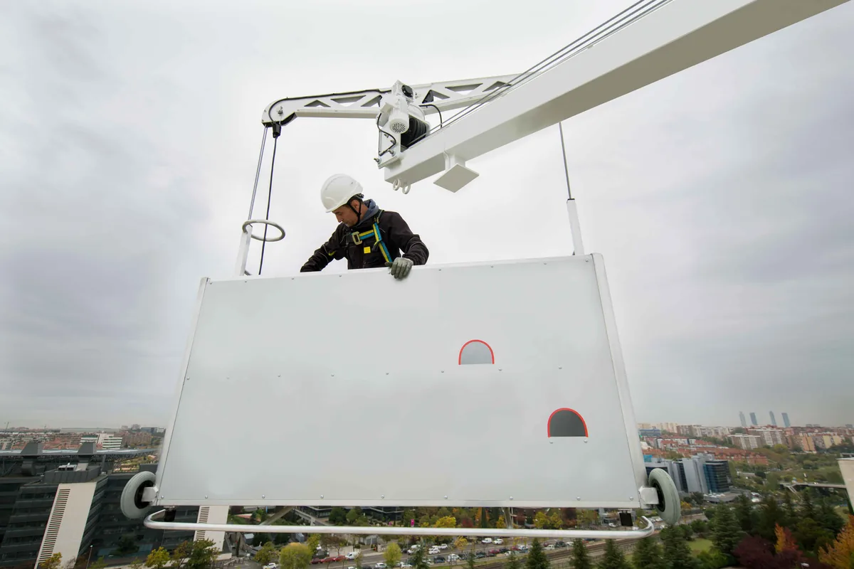Suspended platform at a building exterior.
